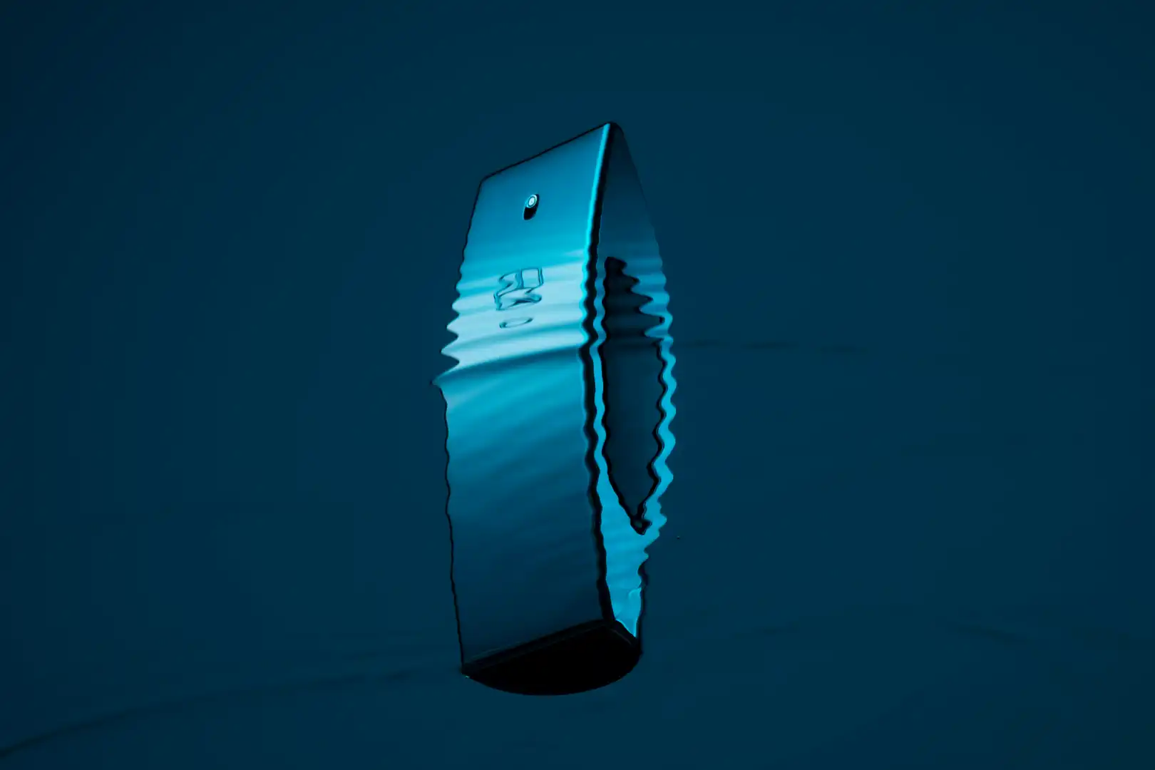 Blue smartphone partially distorted as if viewed through rippling water on a dark blue background.