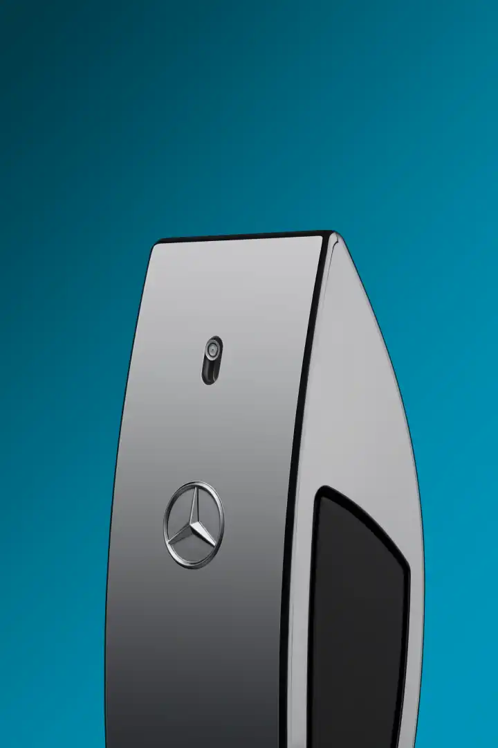 Close-up of a sleek silver Mercedes-Benz car key fob with the Mercedes emblem and a button on a blue gradient background.