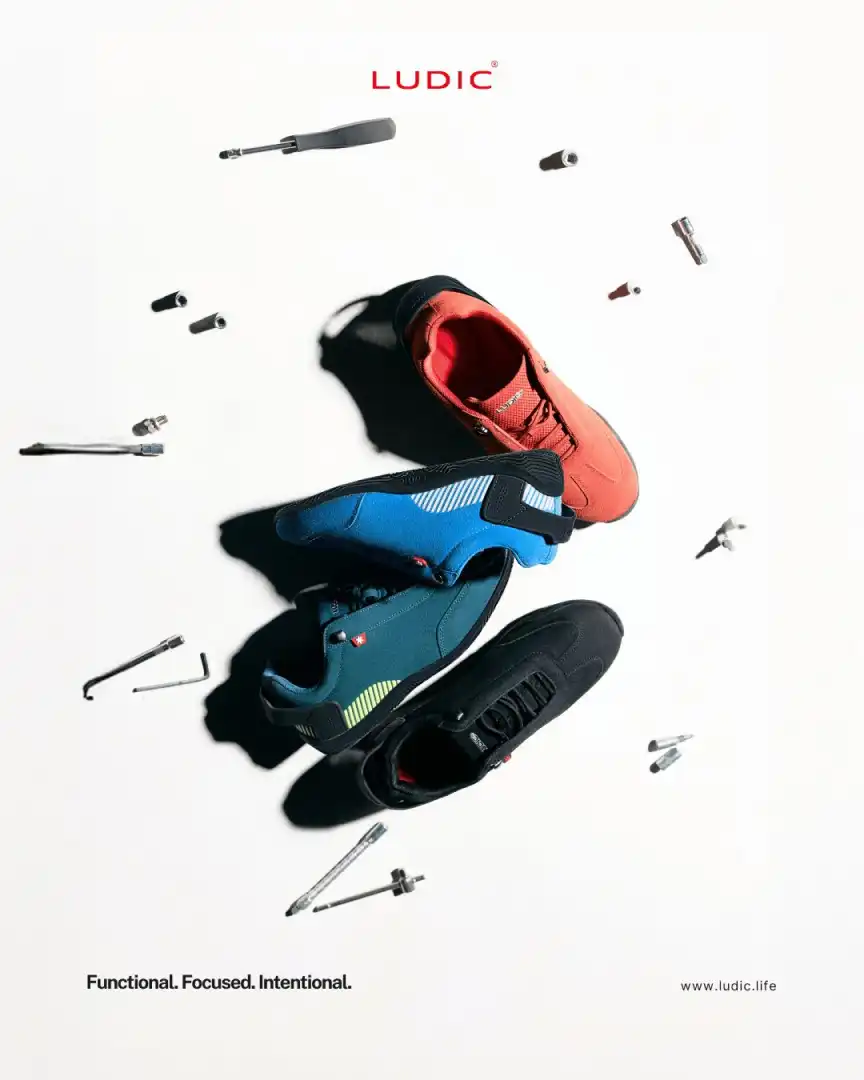 Three pairs of athletic shoes in red, blue, and black arranged on a white background with various tool bits scattered around, featuring the brand name LUDIC.